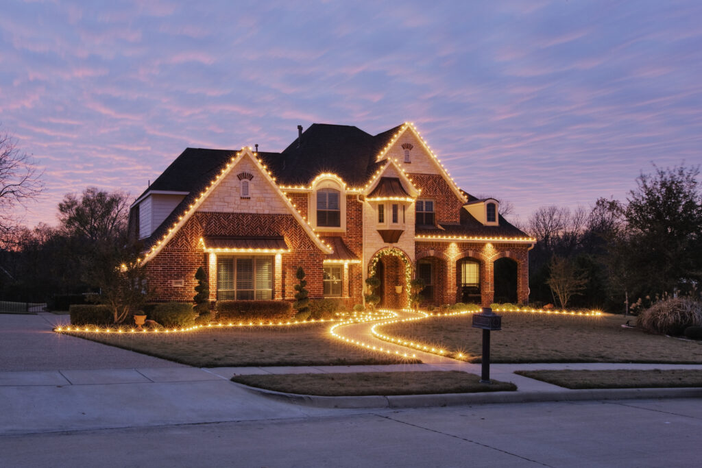 Home decorated with holiday lights.