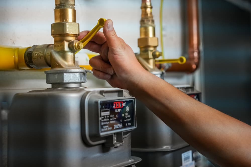 Plumbing adjusting water heater controls
