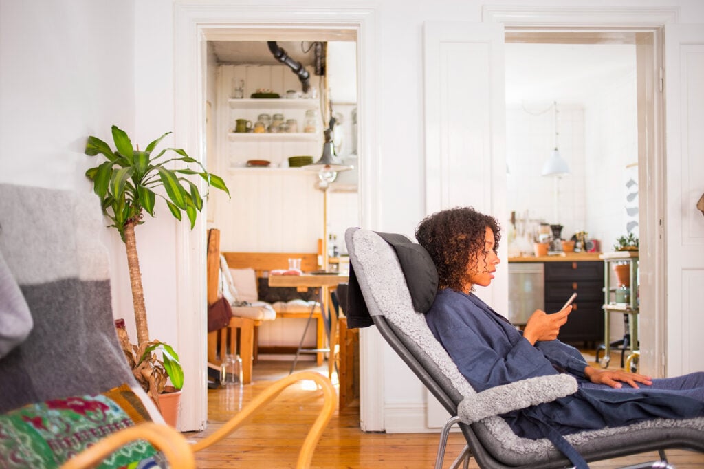 Woman lying down in lounge chair